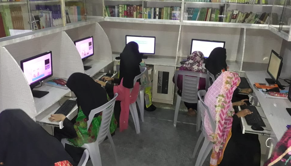 Girls learning computer skills as part of Computer Diploma Training